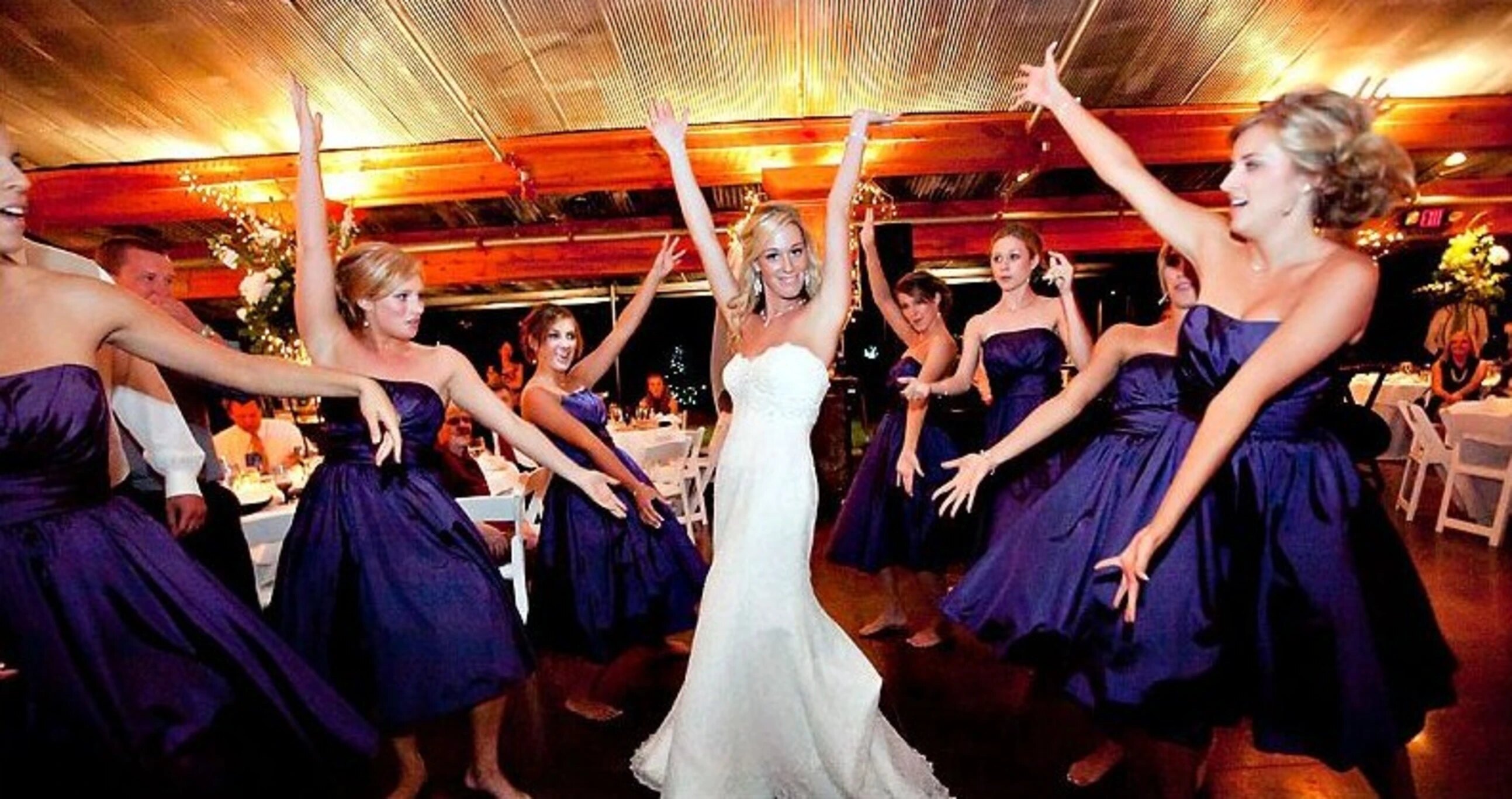 Wedding reception guests celebrating with Ultimate DJ